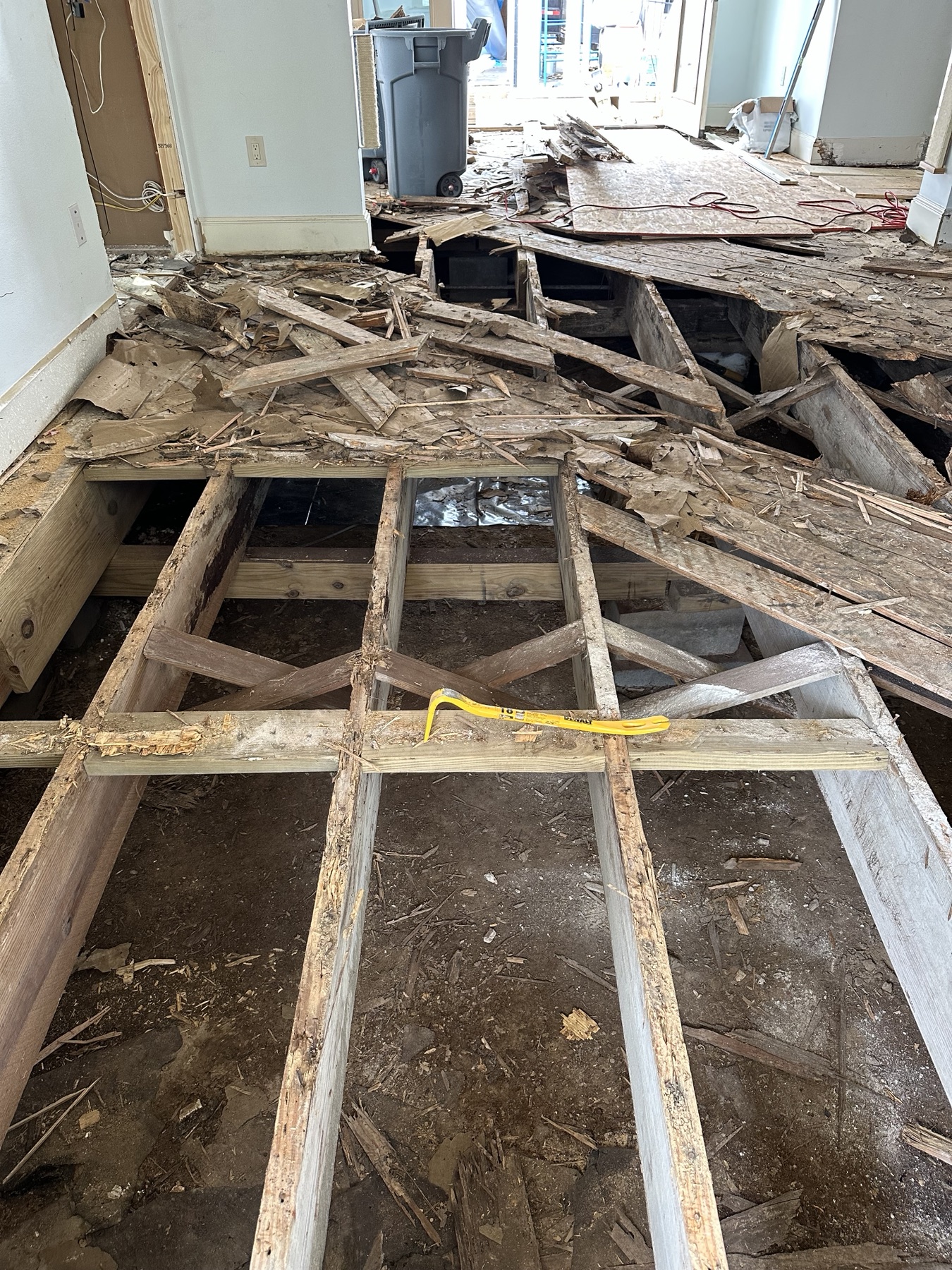 Existing floor joists exposed during structural floor-system work